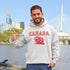 This cozy hoodie features the official mascot of Canadian chill vibes: a Canadian beaver, And smack-dab above the little guy? The iconic word "Canada," so there's no mistaking your loyalty to the land of snow, syrup, and hockey glory!