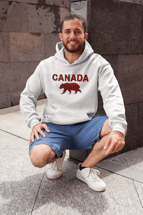 Meet the Plaid & Proud Hoodie, featuring a rugged red & black plaid bear alongside "Canada" in matching plaid lettering—because nothing says “True North strong” like a bear rocking Canadian flannel.