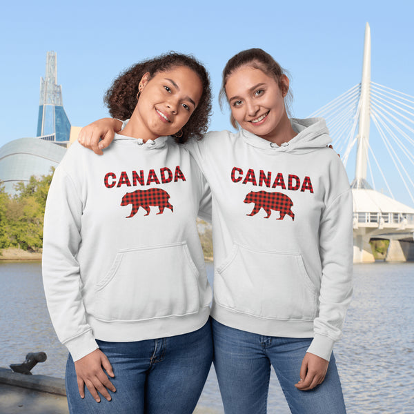 Meet the Plaid & Proud Hoodie, featuring a rugged red & black plaid bear alongside "Canada" in matching plaid lettering—because nothing says “True North strong” like a bear rocking Canadian flannel.