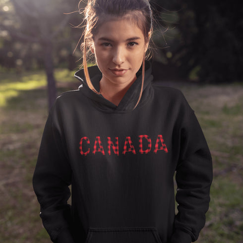 Say hello to the Oh-Canada Hoodie, featuring "Canada" in bold red and black plaid lettering that screams “I’m Canadian, and yes, I’m cozy!”