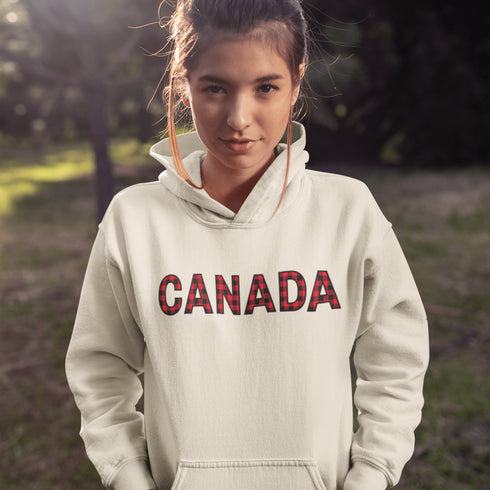 Say hello to the Oh-Canada Hoodie, featuring "Canada" in bold red and black plaid lettering that screams “I’m Canadian, and yes, I’m cozy!”