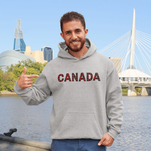 Say hello to the Oh-Canada Hoodie, featuring "Canada" in bold red and black plaid lettering that screams “I’m Canadian, and yes, I’m cozy!”