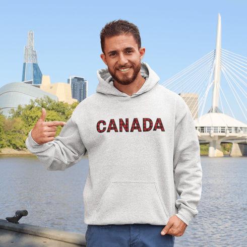 Say hello to the Oh-Canada Hoodie, featuring "Canada" in bold red and black plaid lettering that screams “I’m Canadian, and yes, I’m cozy!”