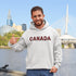 Say hello to the Oh-Canada Hoodie, featuring "Canada" in bold red and black plaid lettering that screams “I’m Canadian, and yes, I’m cozy!”