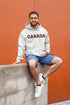 Say hello to the Oh-Canada Hoodie, featuring "Canada" in bold red and black plaid lettering that screams “I’m Canadian, and yes, I’m cozy!”