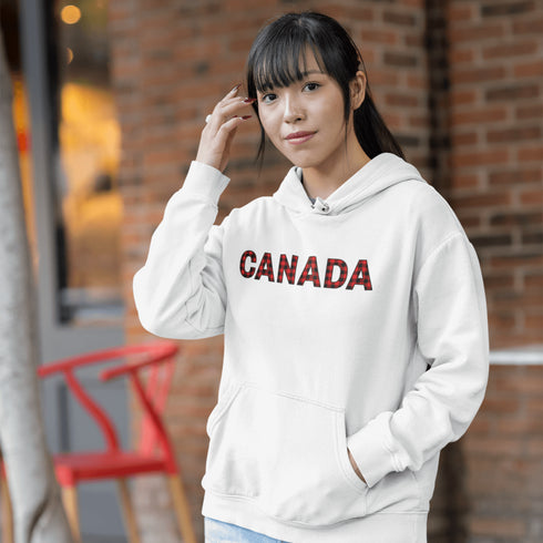 Say hello to the Oh-Canada Hoodie, featuring "Canada" in bold red and black plaid lettering that screams “I’m Canadian, and yes, I’m cozy!”