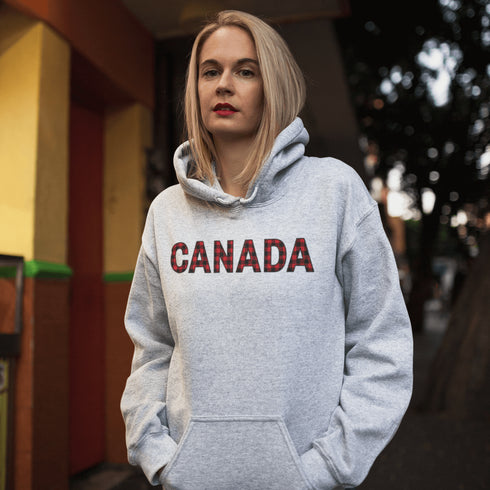 Say hello to the Oh-Canada Hoodie, featuring "Canada" in bold red and black plaid lettering that screams “I’m Canadian, and yes, I’m cozy!”