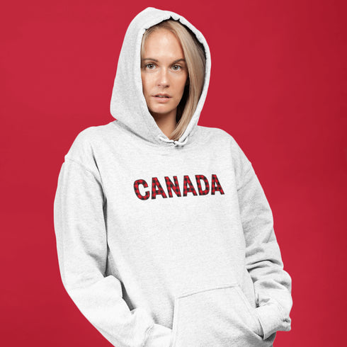Say hello to the Oh-Canada Hoodie, featuring "Canada" in bold red and black plaid lettering that screams “I’m Canadian, and yes, I’m cozy!”
