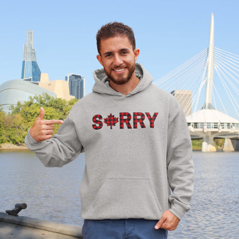Say “Sorry” the Canadian way with our Sorry, Eh? Hoodie! Featuring "Sorry" in red and black plaid with a maple leaf as the “O,” this hoodie is apologetically Canadian in every way.