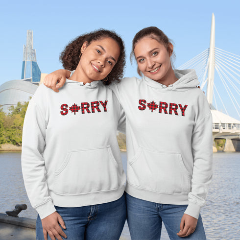 Say “Sorry” the Canadian way with our Sorry, Eh? Hoodie! Featuring "Sorry" in red and black plaid with a maple leaf as the “O,” this hoodie is apologetically Canadian in every way.