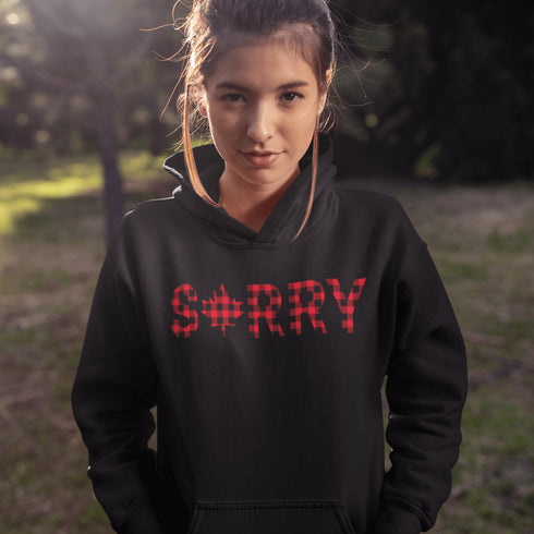 Say “Sorry” the Canadian way with our Sorry, Eh? Hoodie! Featuring "Sorry" in red and black plaid with a maple leaf as the “O,” this hoodie is apologetically Canadian in every way.