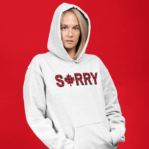 Say “Sorry” the Canadian way with our Sorry, Eh? Hoodie! Featuring "Sorry" in red and black plaid with a maple leaf as the “O,” this hoodie is apologetically Canadian in every way.