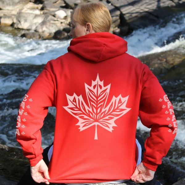 Premium Canada hoodie featuring Indigenous-inspired maple leaf art and Canada sleeve print. Cozy unisex sweatshirt perfect for travel, gifts, and everyday wear.