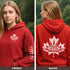 Premium Canada hoodie featuring Indigenous-inspired maple leaf art and Canada sleeve print. Cozy unisex sweatshirt perfect for travel, gifts, and everyday wear.