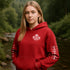 Premium Canada hoodie featuring Indigenous-inspired maple leaf art and Canada sleeve print. Cozy unisex sweatshirt perfect for travel, gifts, and everyday wear.