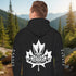 Premium Canada hoodie featuring Indigenous-inspired maple leaf art and Canada sleeve print. Cozy unisex sweatshirt perfect for travel, gifts, and everyday wear.