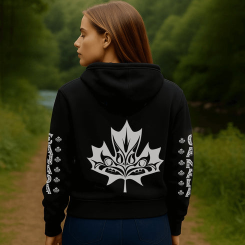 Premium Canada hoodie featuring Indigenous-inspired maple leaf art and Canada sleeve print. Cozy unisex sweatshirt perfect for travel, gifts, and everyday wear.