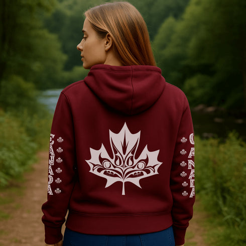 Premium Canada hoodie featuring Indigenous-inspired maple leaf art and Canada sleeve print. Cozy unisex sweatshirt perfect for travel, gifts, and everyday wear.