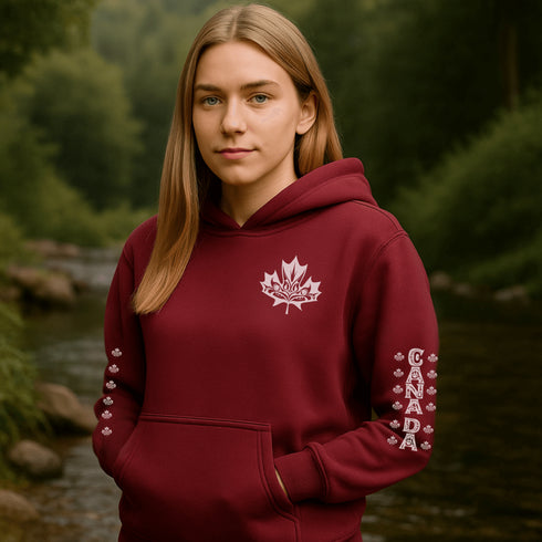 Premium Canada hoodie featuring Indigenous-inspired maple leaf art and Canada sleeve print. Cozy unisex sweatshirt perfect for travel, gifts, and everyday wear.