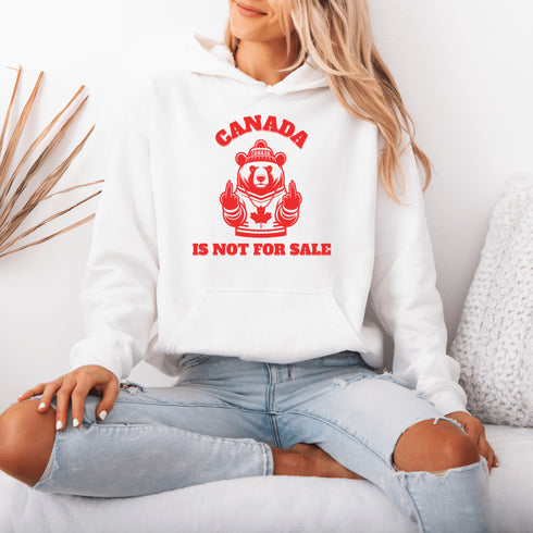 Show off your unapologetic Canadian pride with our bold and rebellious "Canada Is Not For Sale" hoodie. Featuring a feisty bear rocking a Canada shirt and hat.