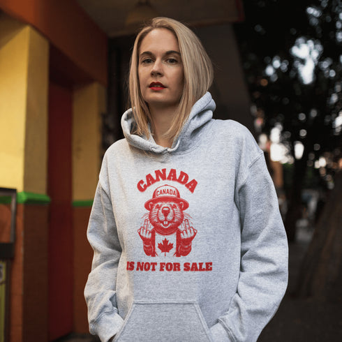 Show off your unapologetic Canadian pride with our bold and rebellious "Canada Is Not For Sale" hoodie. Featuring a feisty beaver rocking a Canada shirt and hat