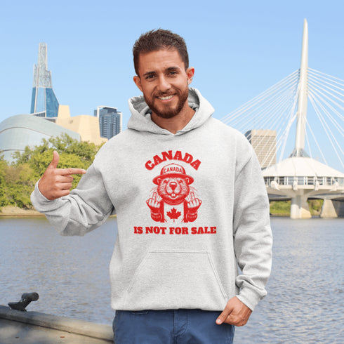 Show off your unapologetic Canadian pride with our bold and rebellious "Canada Is Not For Sale" hoodie. Featuring a feisty beaver rocking a Canada shirt and hat