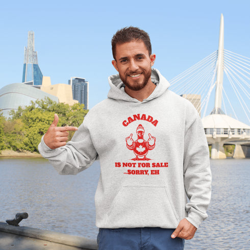 Make a bold statement with our "Canada Is Not For Sale" hoodie, featuring a fearless Canadian goose rocking a Canada shirt and hat