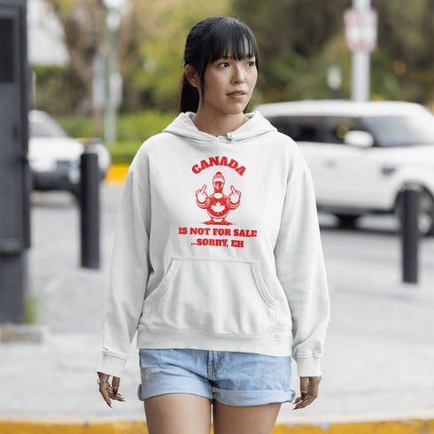 Make a bold statement with our "Canada Is Not For Sale" hoodie, featuring a fearless Canadian goose rocking a Canada shirt and hat