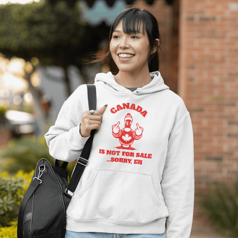Make a bold statement with our "Canada Is Not For Sale" hoodie, featuring a fearless Canadian goose rocking a Canada shirt and hat