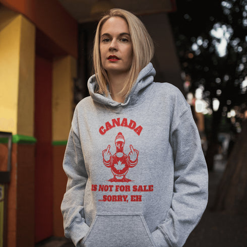 Make a bold statement with our "Canada Is Not For Sale" hoodie, featuring a fearless Canadian goose rocking a Canada shirt and hat