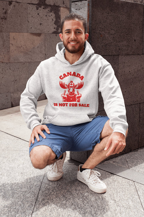 Show off your unapologetic Canadian pride with our bold and rebellious "Canada Is Not For Sale" hoodie. Featuring a feisty moose rocking a Canada shirt and hat