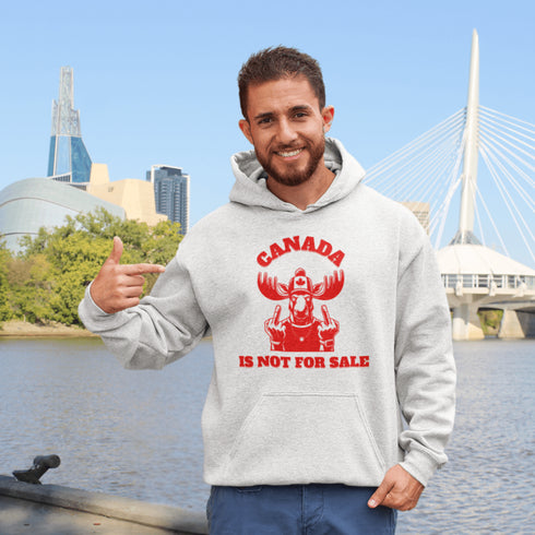 Show off your unapologetic Canadian pride with our bold and rebellious "Canada Is Not For Sale" hoodie. Featuring a feisty moose rocking a Canada shirt and hat