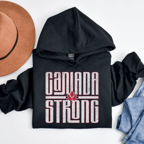 Canada Strong Hoodie – Retro Vibes, Maple Syrup Approved! Show off your unapologetically Canadian strength with the Canada Strong hoodie.