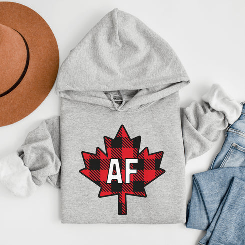 Featuring a red & black plaid maple leaf and the letters “AF” proudly displayed, this hoodie is for anyone who’s unapologetically Canadian… AF.