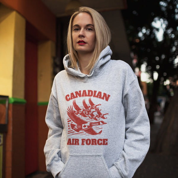 Defend the skies (or at least the local pond) with our "Canadian Air Force" hoodie! Featuring a flock of geese flying in a perfect fighter jet formation
