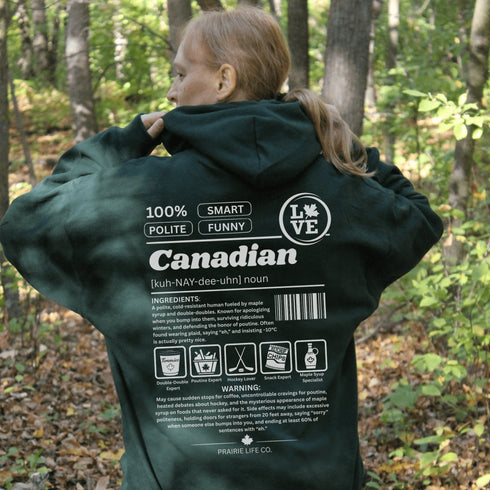 Show your Canadian pride with this funny Canadian definition hoodie featuring maple syrup, hockey, poutine and double-doubles. A cozy hoodie perfect for true Canadians.