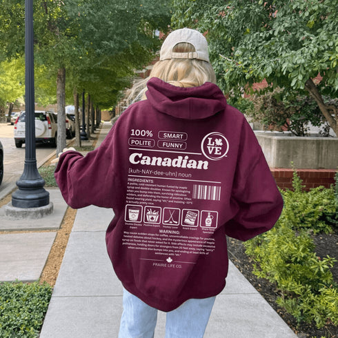 Show your Canadian pride with this funny Canadian definition hoodie featuring maple syrup, hockey, poutine and double-doubles. A cozy hoodie perfect for true Canadians.