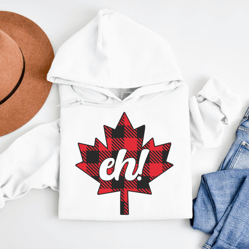 Featuring a bold Canadian maple leaf in classic red and black plaid with a proudly placed "Eh!" on the front, this hoodie is as Canadian as maple syrup on poutine.
