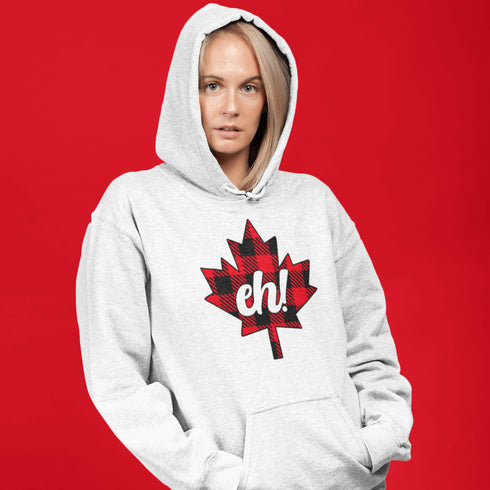 Featuring a bold Canadian maple leaf in classic red and black plaid with a proudly placed "Eh!" on the front, this hoodie is as Canadian as maple syrup on poutine.