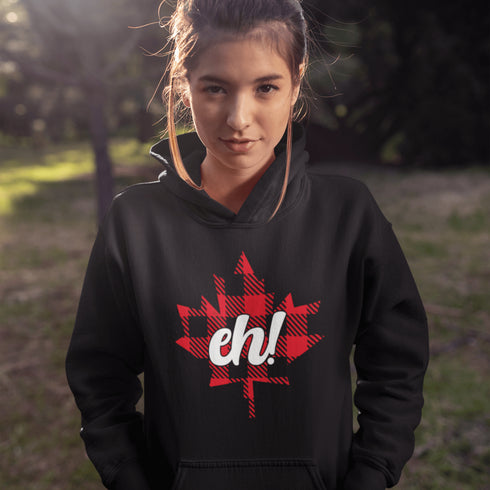 Featuring a bold Canadian maple leaf in classic red and black plaid with a proudly placed "Eh!" on the front, this hoodie is as Canadian as maple syrup on poutine.