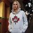 Featuring a bold Canadian maple leaf in classic red and black plaid with a proudly placed "Eh!" on the front, this hoodie is as Canadian as maple syrup on poutine.