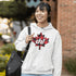 Featuring a bold Canadian maple leaf in classic red and black plaid with a proudly placed "Eh!" on the front, this hoodie is as Canadian as maple syrup on poutine.