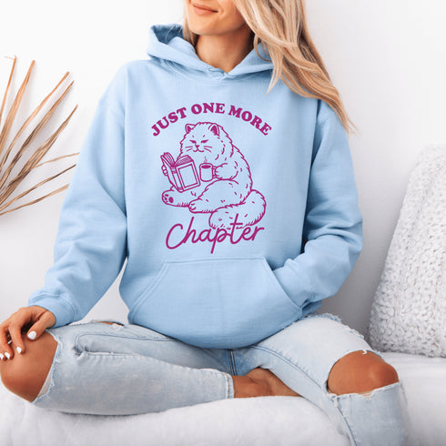 This hoodie features a studious cat perched with a book, proving that even felines can't resist the pull of "just one more chapter."