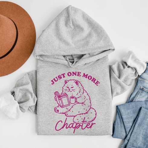 This hoodie features a studious cat perched with a book, proving that even felines can't resist the pull of "just one more chapter."