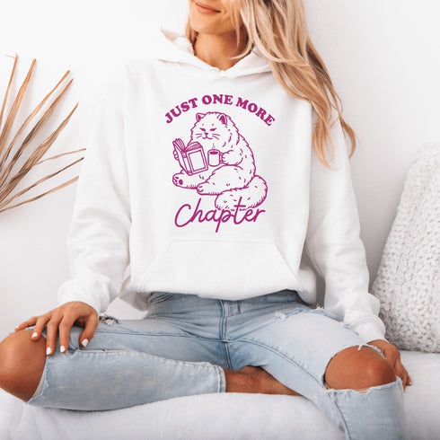 This hoodie features a studious cat perched with a book, proving that even felines can't resist the pull of "just one more chapter."