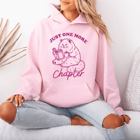 This hoodie features a studious cat perched with a book, proving that even felines can't resist the pull of "just one more chapter."