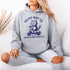 Featuring a playful illustration of a determined cat riding a scooter, this hoodie is the purr-fect way to announce your cat-loving intentions to the world.