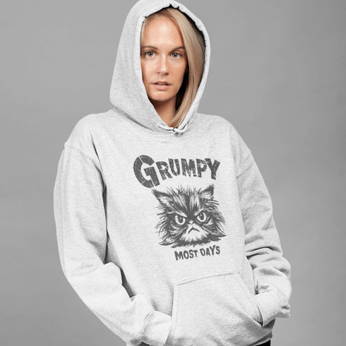 Introducing the "Grumpy Most Days" Hoodie—because let's face it, some days just require a permanent scowl. Featuring the grumpiest cat you’ve ever seen, this hoodie is perfect for those days when coffee, sunshine, or people just aren't cutting it.