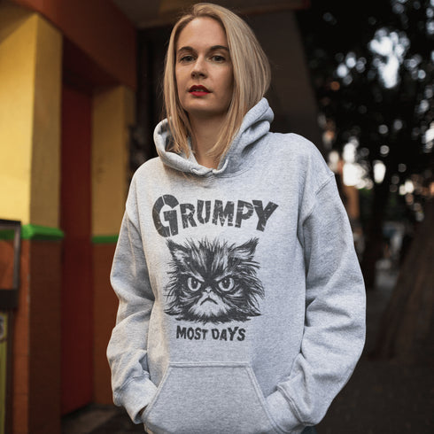Introducing the "Grumpy Most Days" Hoodie—because let's face it, some days just require a permanent scowl. Featuring the grumpiest cat you’ve ever seen, this hoodie is perfect for those days when coffee, sunshine, or people just aren't cutting it.
