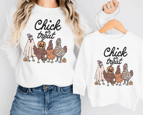 Get ready to ruffle some feathers with the Chick or Treat sweatshirt! Featuring a flock of adorable cartoon chickens dressed up for Halloween, these little cluckers are out for more than just corn this year—they're here for candy!